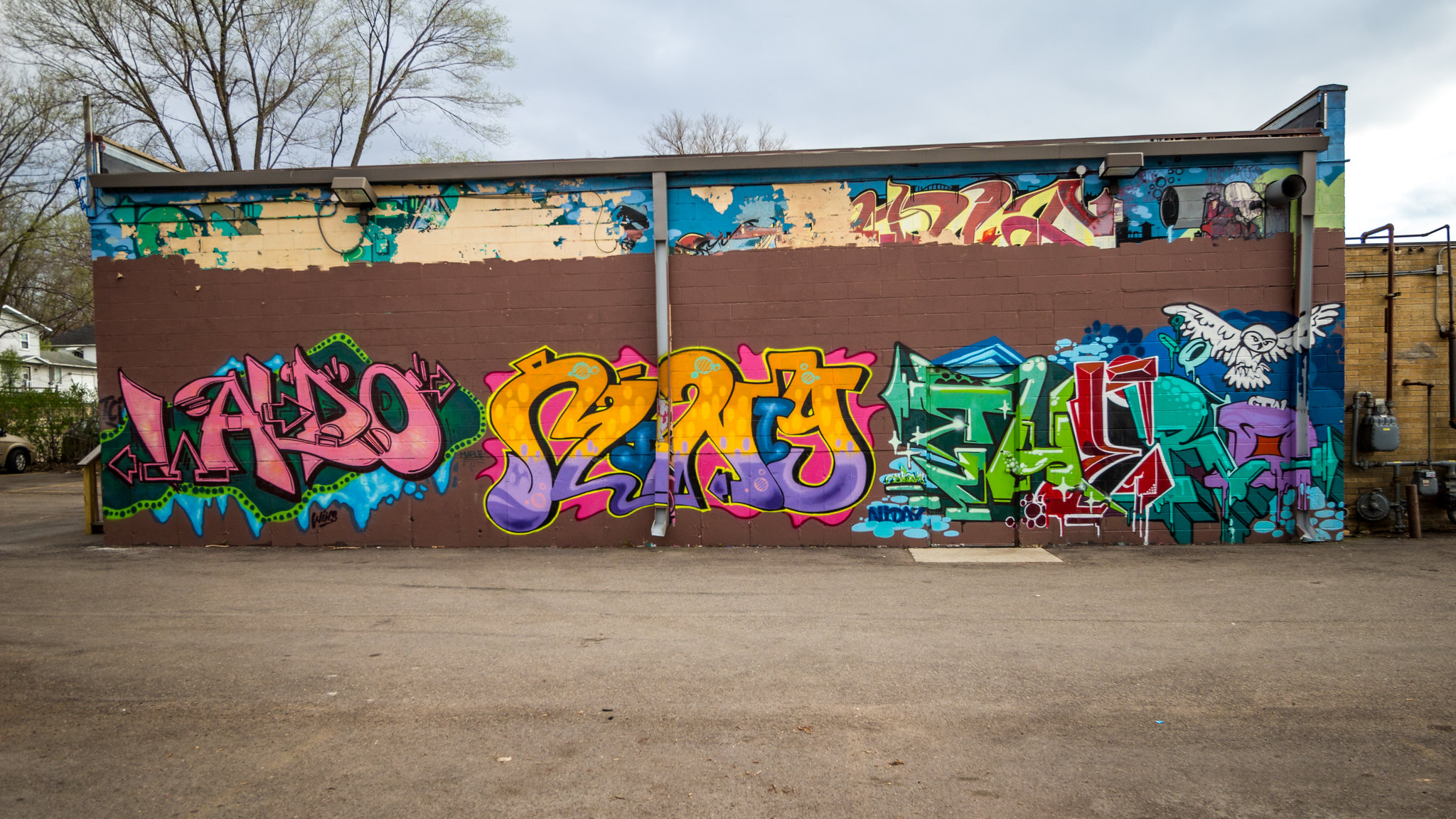 Side of a building with graffiti tags